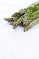Green asparagus on a white napkin. Selective focus.