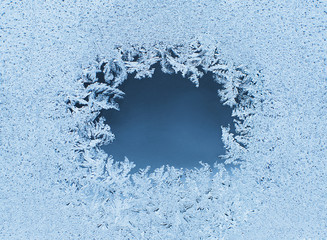 Winter background, frost on window