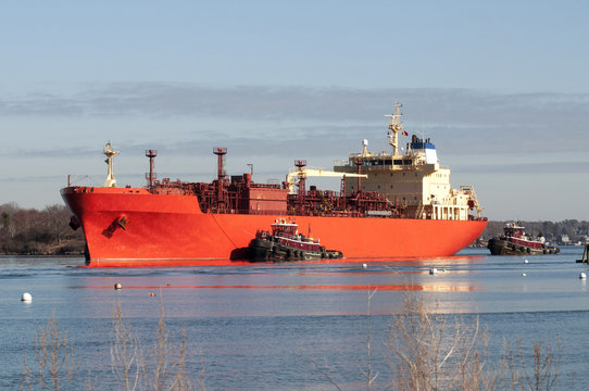 Tugboats Guiding Oil Tanker Ship