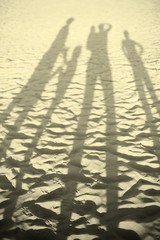 happy large family on beach sunset shadows