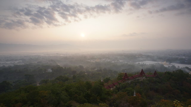 Timelapse of beautiful sunrise over Mandalay Hill. Mandalay. Myanmar. Best famous place to see sunrise at Mandalay region.
