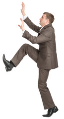 Businessman climbing up  