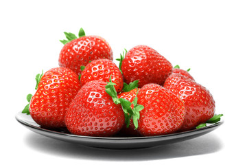 Strawberries on plate isolated on white background