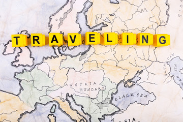 Word Traveling on world map background