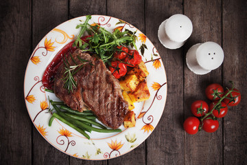 Beef steak with roasted potato and vegetables