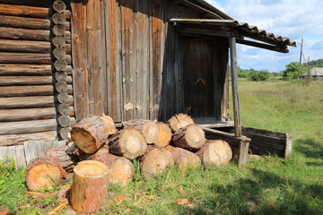 A bunch of the pine chumps for firewood stacked at the old barn