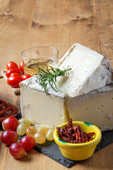 Typical Spanish cheese with wine, grapes and cherry tomatoes