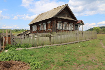 Fototapeta na wymiar Very old wooden house in the remote Russian village in the summer