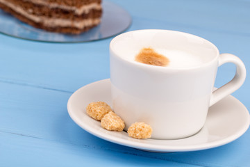 Cappuccino and coockie on a table