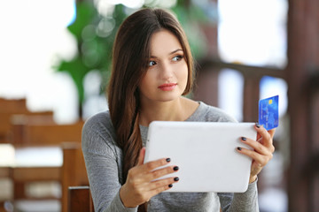 Young woman working with tablet in the office