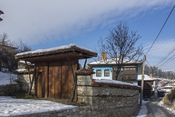 snowy street in historical town of Koprivshtitsa, Sofia Region, Bulgaria