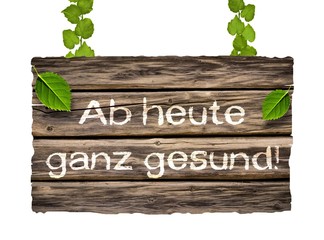Ab heute ganz gesund! - an Efeuranken hängendes Holzschild