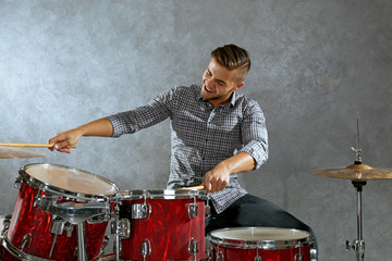 Musician playing the drums in a studio