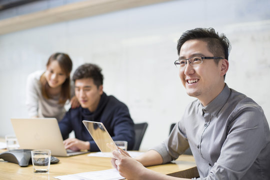 IT workers developing digital tablet
