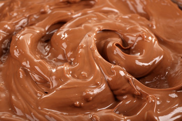 Background of melted milk chocolate, close-up