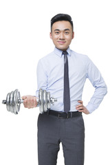 Naklejka premium Young businessman lifting weights