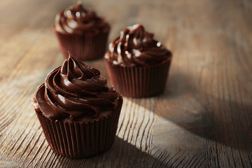 Chocolate cupcakes on wooden table