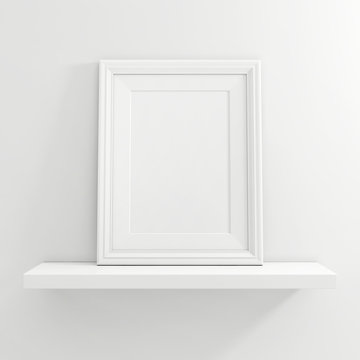 white blank photo frame on white shelf on white background