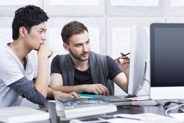 Young adults discussing in office