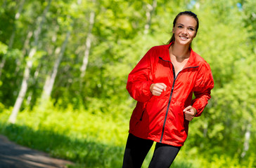 healthy young female athlete running