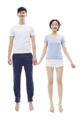 Young couple sleeping in mid-air