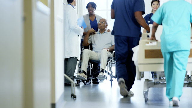 African American couple male on wheelchair consult with doctor in hospital