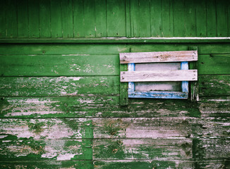 Old painted wood wall with close window