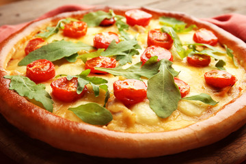 Pizza Margherita with arugula, close-up