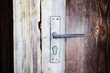 Handle on the old wooden door