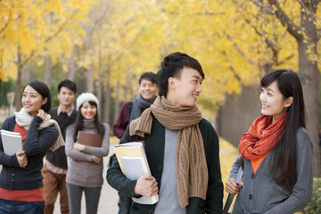 Obraz premium College students on campus in autumn
