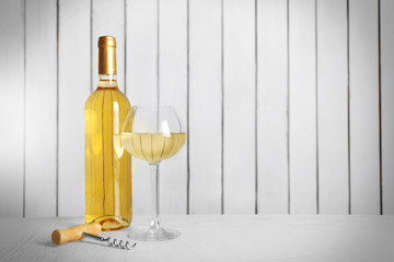 Wine on wooden wall background