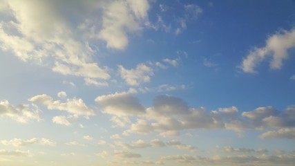 Obraz premium Beautiful blue sky with fluffy white clouds