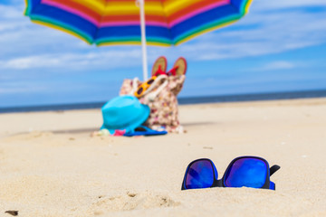 Sunglasses gadgets sunbathers background