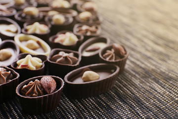 Chocolate sweets on fabric background