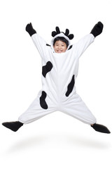 Excited Boy Dressed in a Cow Costume Jumping