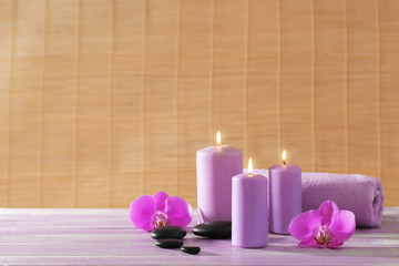 Obraz na płótnie Canvas Spa set with flowers on wooden table