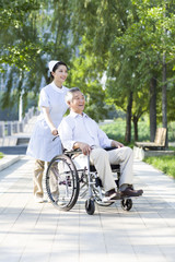 Nurse with wheelchair bound patient
