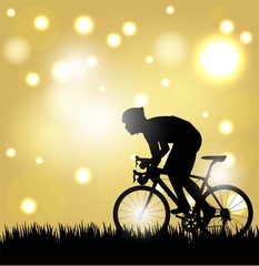 Fototapeta na wymiar silhouette of cyclist pedaling uphill