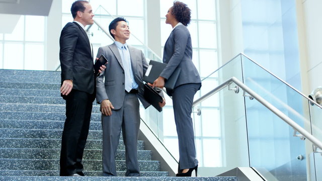 handshake male female multi ethnic business team financial office tablet laptop