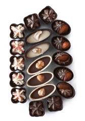 Composition of chocolate candies on white background