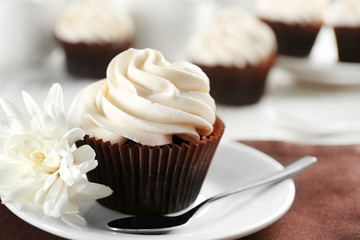Tasty cupcake on served table, close up