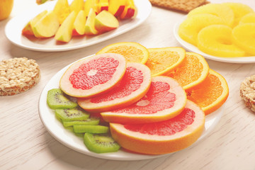 Fruits on light wooden background. healthy eating concept.