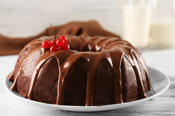 Chocolate cake with a bottle of milk on a table