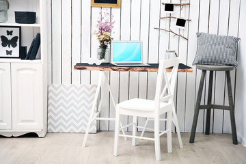 Modern workplace for designer on brick wall background