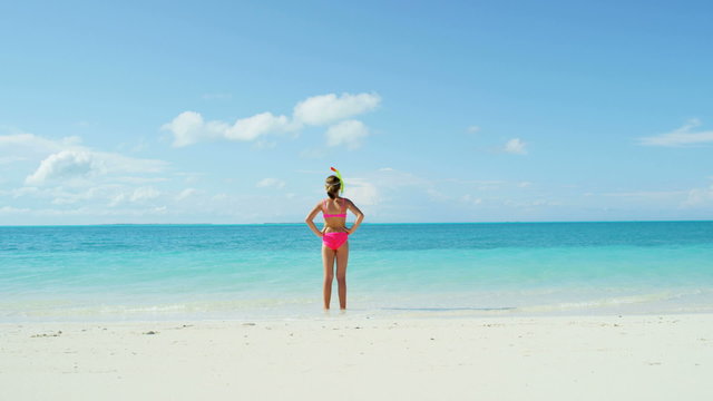 happy healthy young female Caucasian child beach tropical ocean living