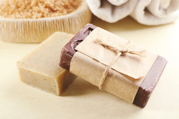 Soap set and salt on a beige background, close up