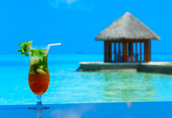 cocktail with blur beach on background