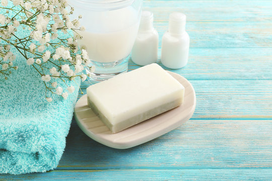 Soap on a dish over wooden background