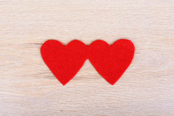 Red hearts on wooden background