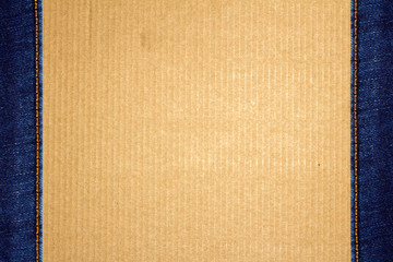 Fototapeta premium Frame of stitched blue jeans on cardboard
